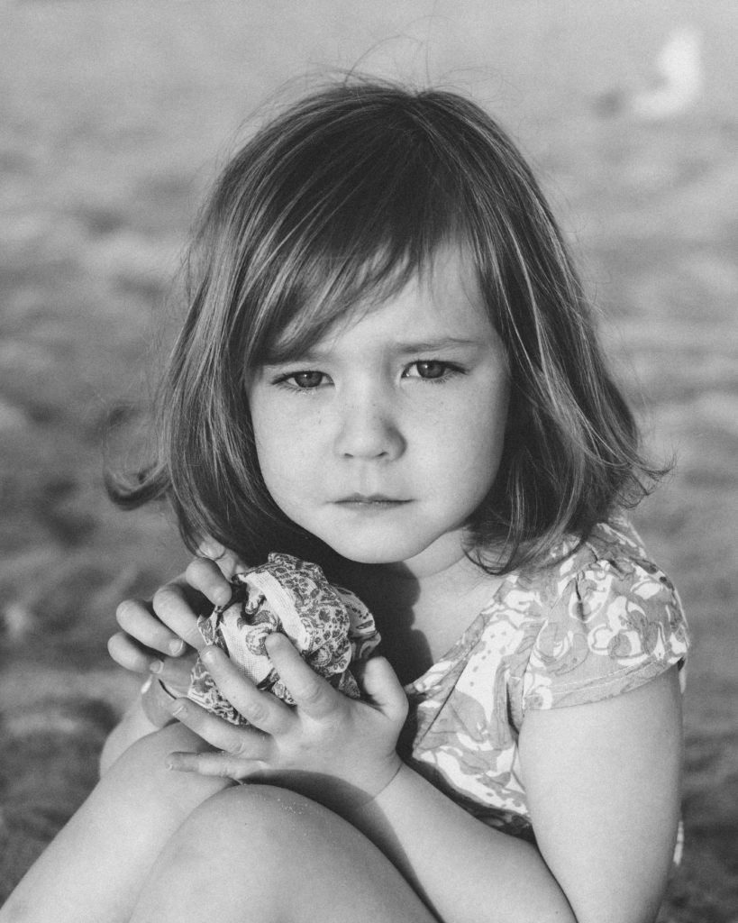 preschool girl portrait in black and white with direct eye contact