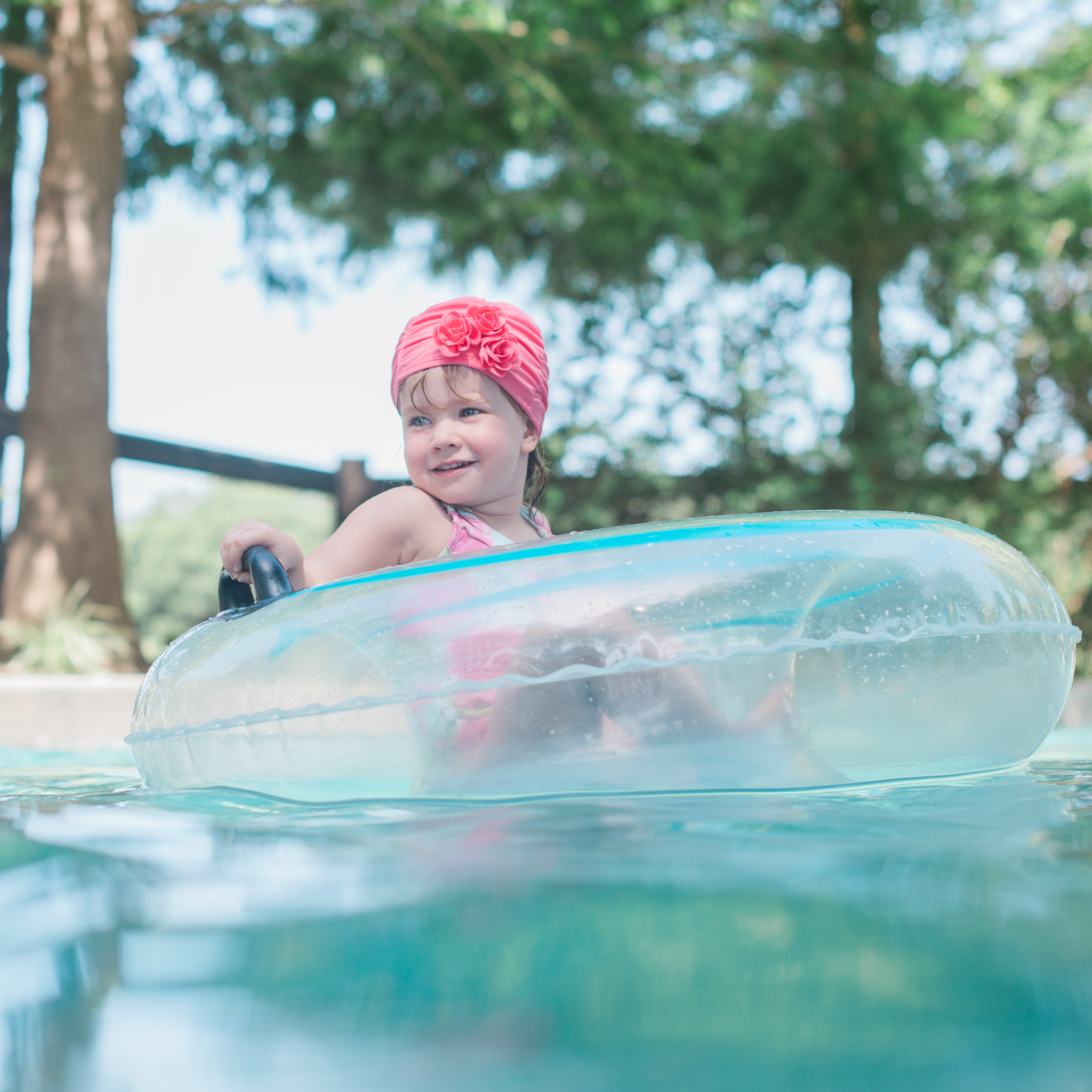little girl floating in tube at Lost Pines Resort