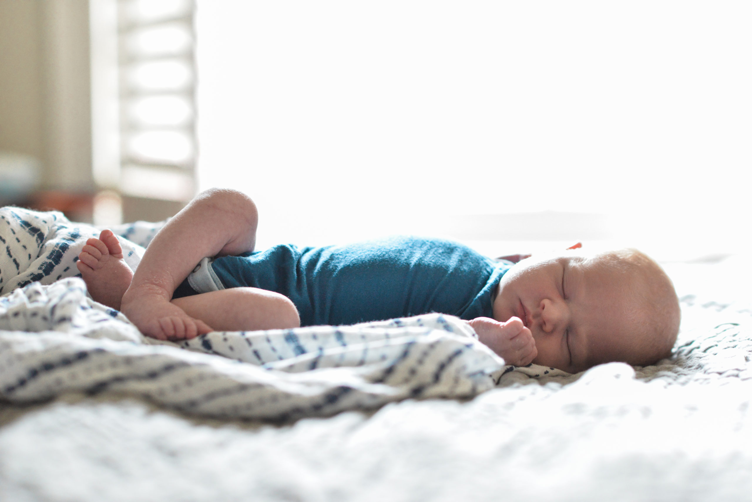 streaming light pours onto sleeping baby